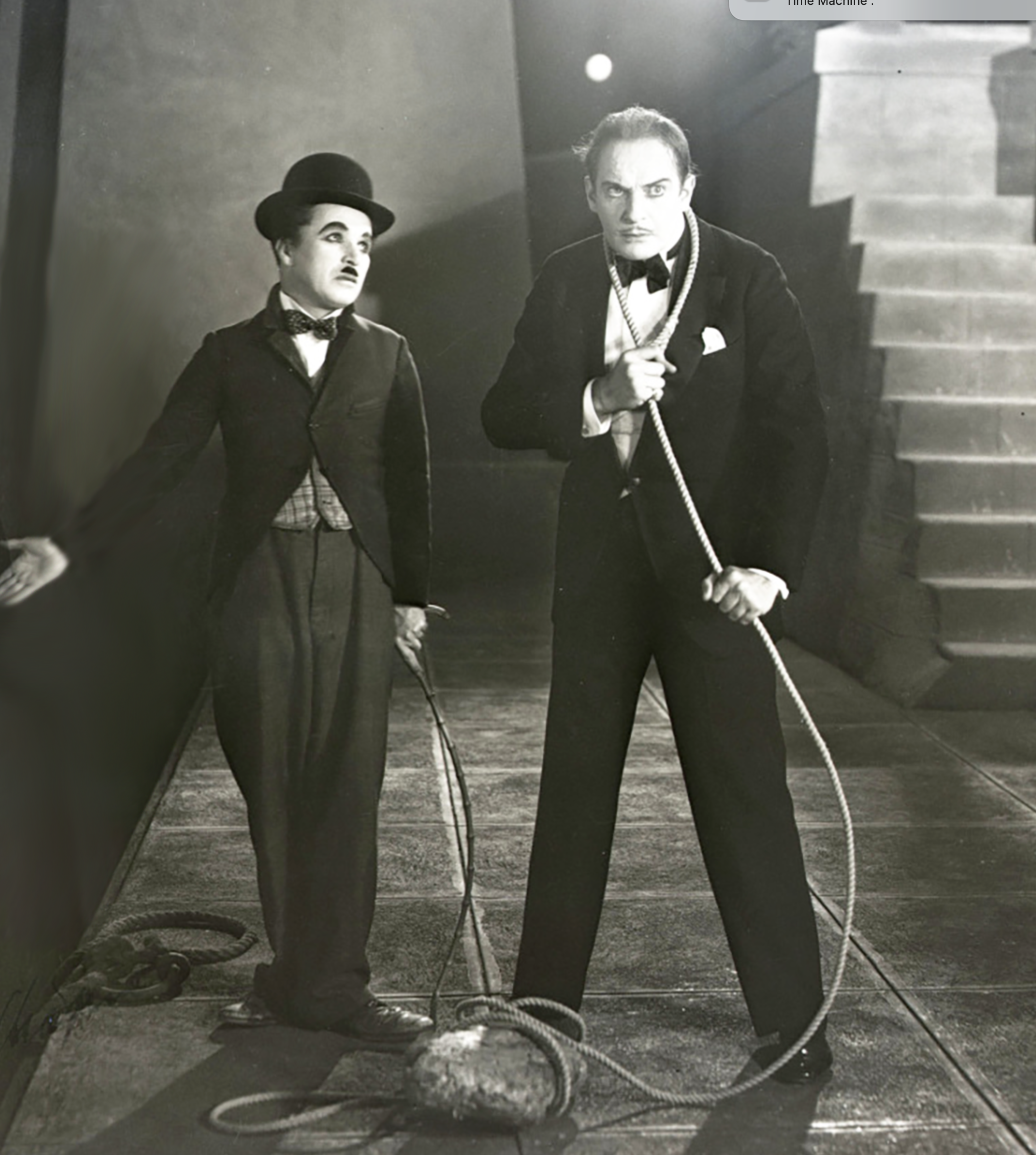 Black-and-white photo of Charlie Chaplin and Henry Clive in a scene from City Lights film 