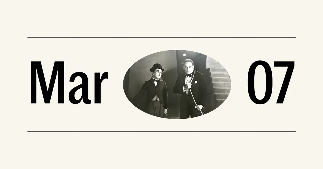 “Mar 07” with a vintage photo of two men in formal wear—one Chaplin-like, the other holding a cane—standing by stairs.