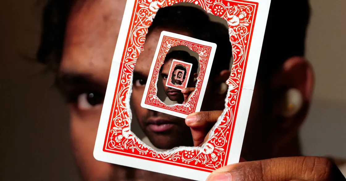 Annanya George holding a magical card